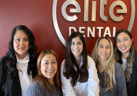 Smiling dentist and team members at Elite Dental of Fountain Valley