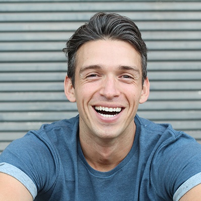 closeup of young man smiling 