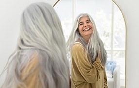 Patient in Fountain Valley smiling with dental implants