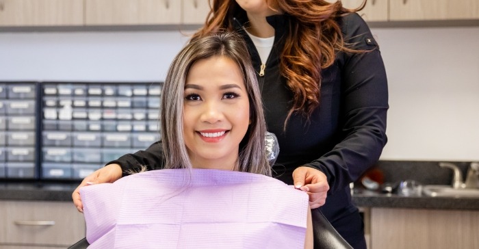 Young woman smiling in dental chair at Elite Dental of Fountain Valley