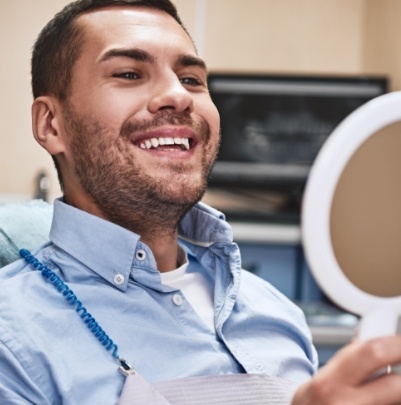 Man and woman smiling after using dental special offers in Fountain Valley