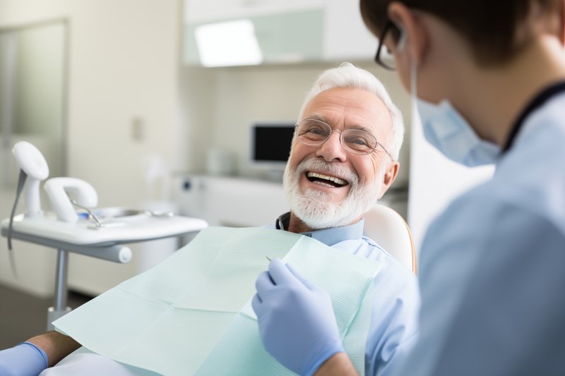 older man smiling in the dentist’s chair